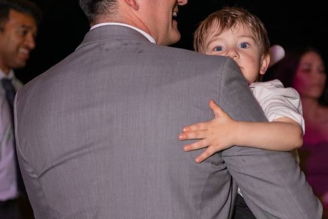 Groom holding son