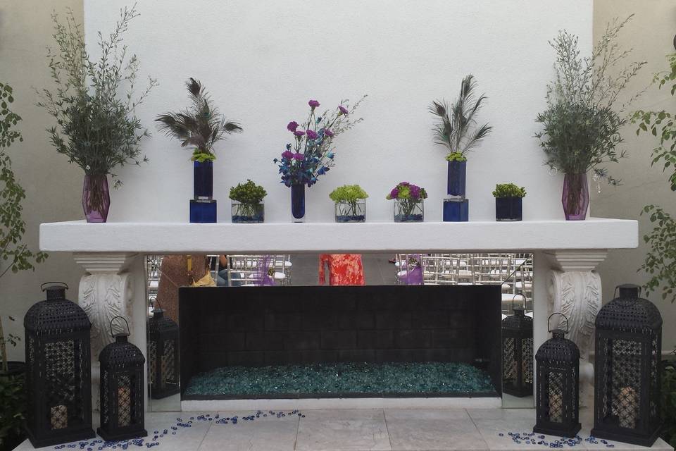 Take advantage of the beautiful fireplace for an outdoor ceremony at SoHo63. For this ceremony, we combined playful and unique textures in purples and greens to bring a pop of color to this beautiful space.