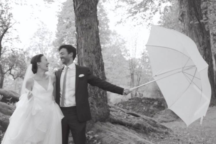 Couple poses with an umbrella