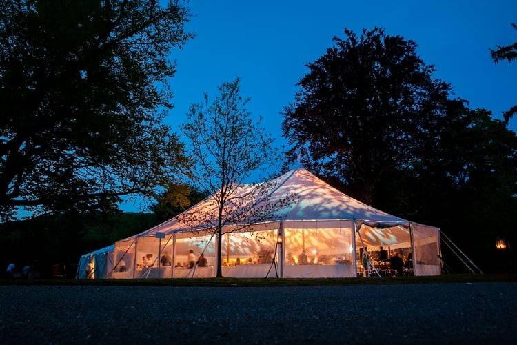 Wedding tent at night at The Lenox Club