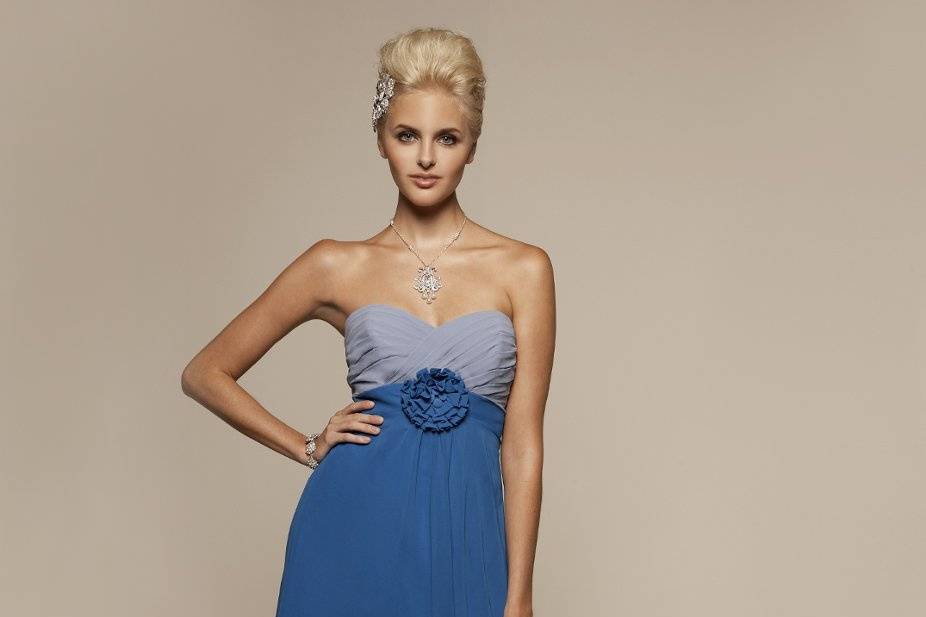 Liz Fields Bridesmaids Dress #359
Pleated sweetheart bodice with ruffled flower and covered button detail at waistband. Two-tone available. Optional spaghetti straps included.
Matching shawl is included.