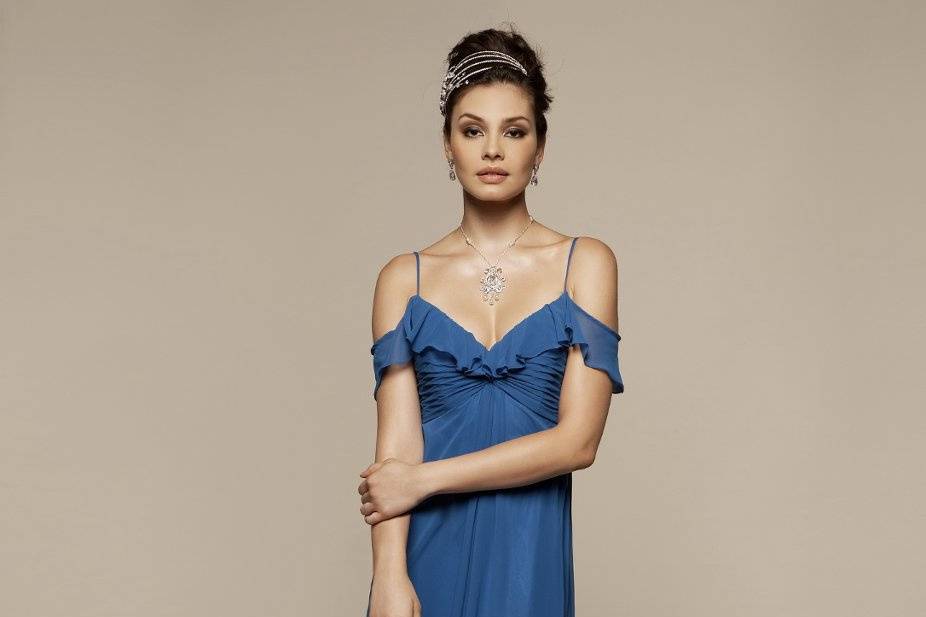 Liz Fields Bridesmaids Dress #360
Shirred, asymmetric bodice with cascading skirt overlay. Covered rhinestone embellishment at gathered waist. Two-tone available. Optional spaghetti straps included.