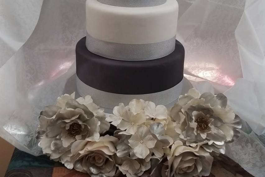 Black, silver, and white wedding cake