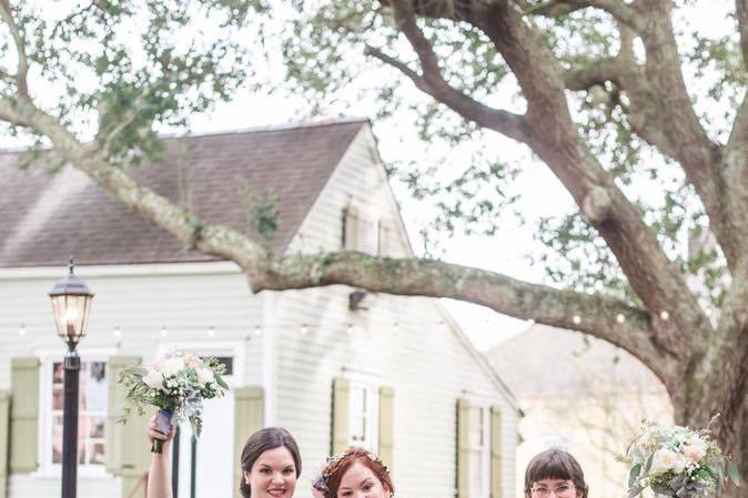 Bride with bridesmaids and flower girl