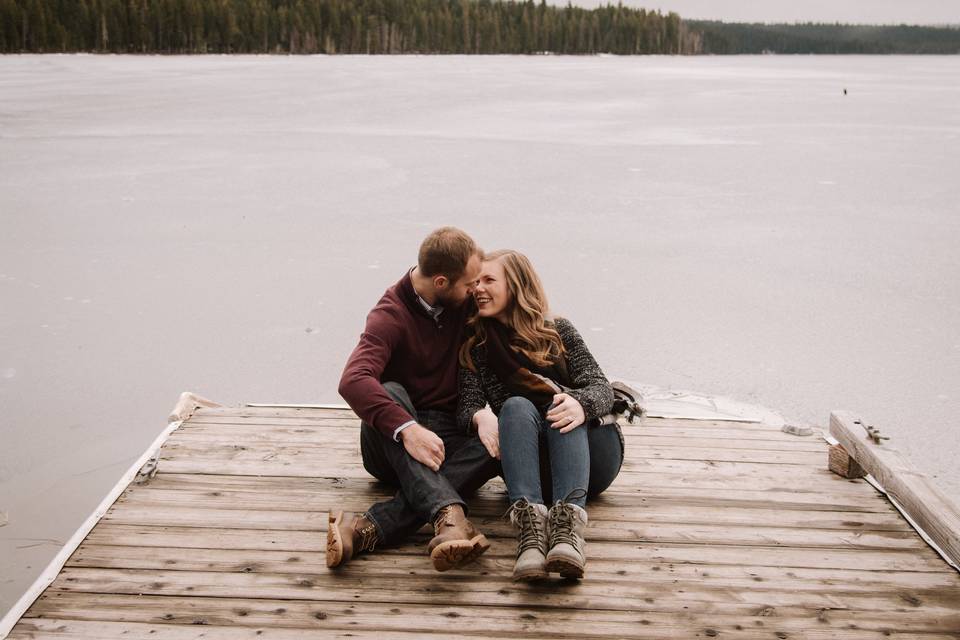 Engaged couple on a dock