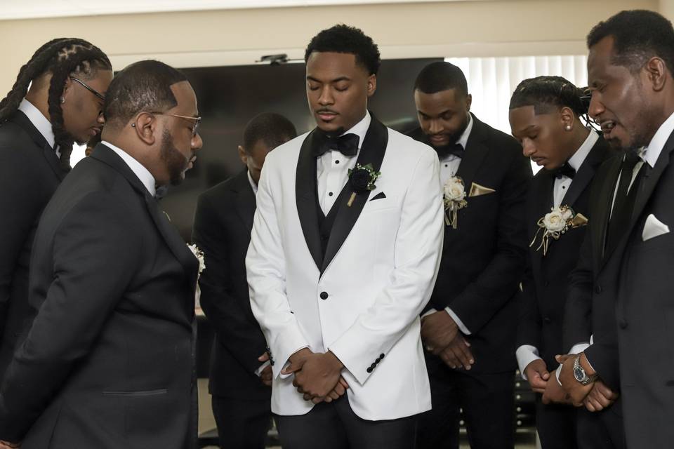 Groom and groomsmen sharing a