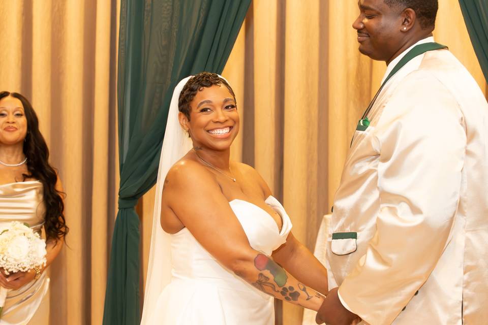 Bride smiles while holding the