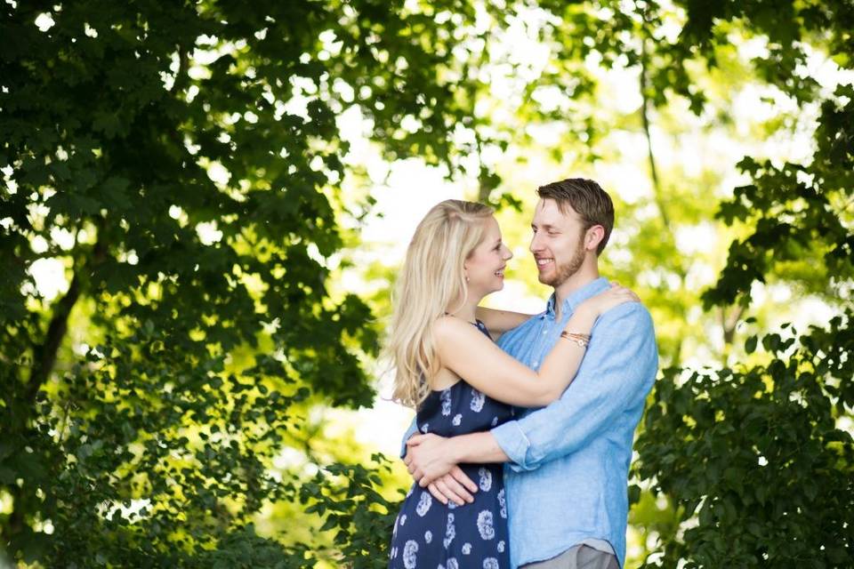 Bride and groom under trees