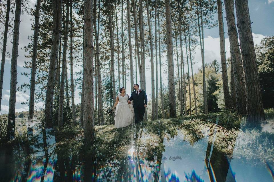 Newlyweds taking a walk in the woods
