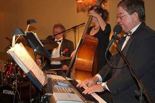 Kevin Campfield, drums and vocals, and Chelsea Chason, bass, with Ted's orchestra for a wedding in St. Augustine.