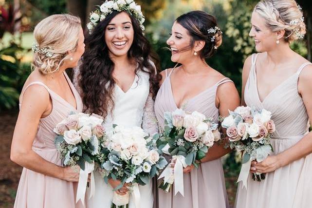 The bride holding her bouquet with her bridesmaid