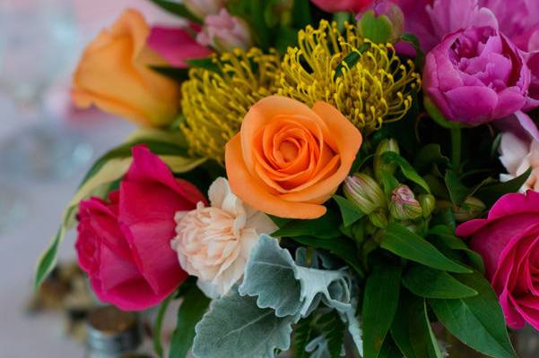 Rosie riot, pincushion protea, dusty miller, roses