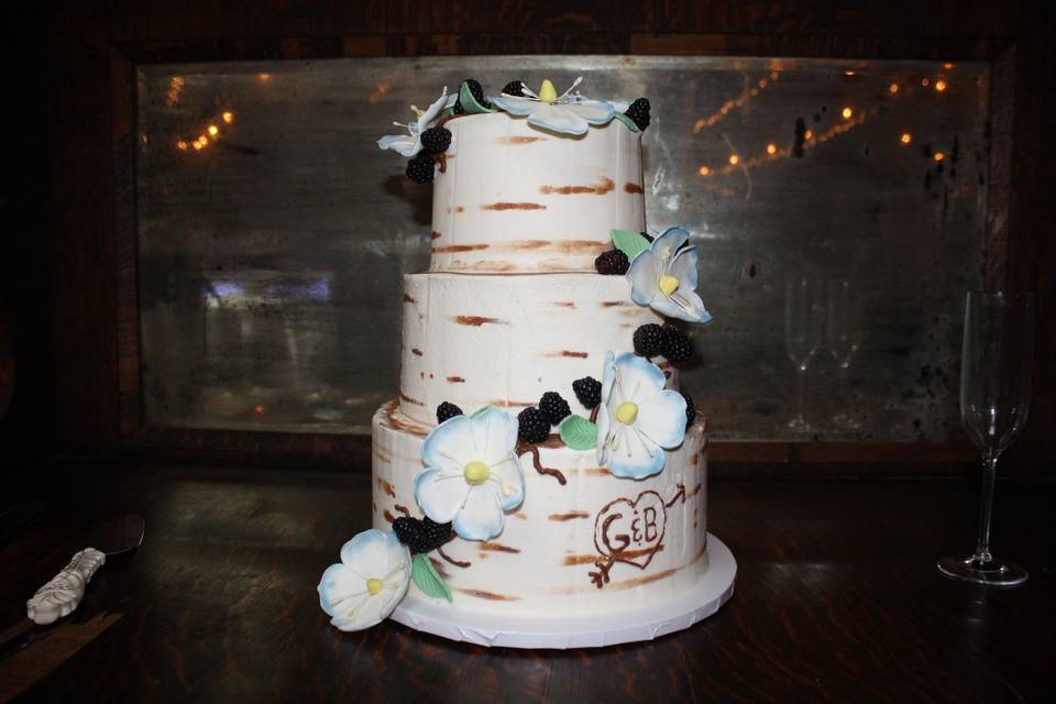 Naked wedding cake with dainty flowers