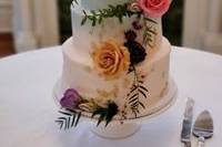 White wedding cake with spring flowers