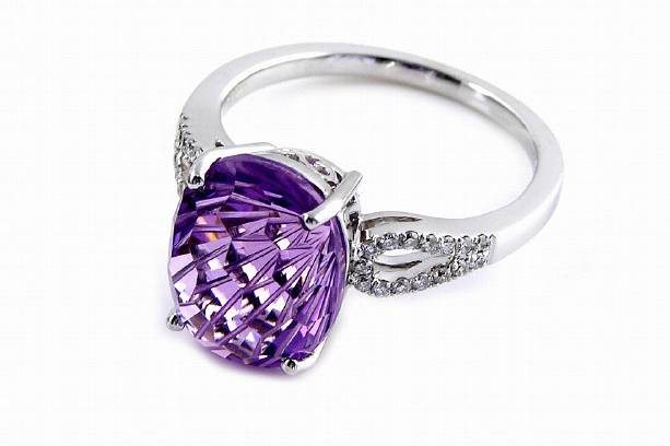 This beautiful designer fashion ring is unique with its specialty cut center stone. The Daisy Cut Amethyst is sure to sparkle and mesmerize passers-by!