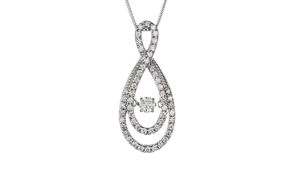 This 14K White Gold pendant is sure to be an eye-catcher! The center diamond is called a dancing diamond or a heartbeat diamond, as it dances and beats with her every heartbeat!