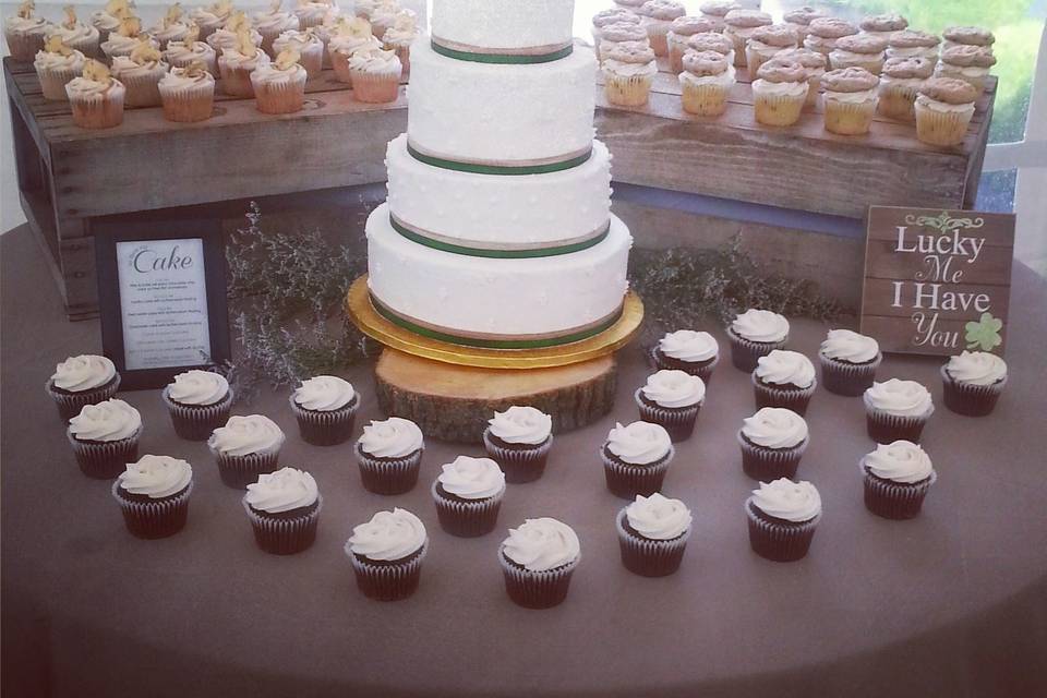 4 tier round cake with 6 dozen cupcakes