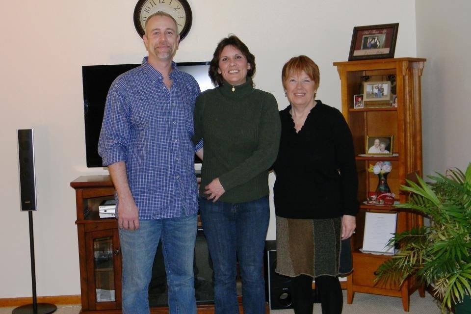 Groom and bride with officiant