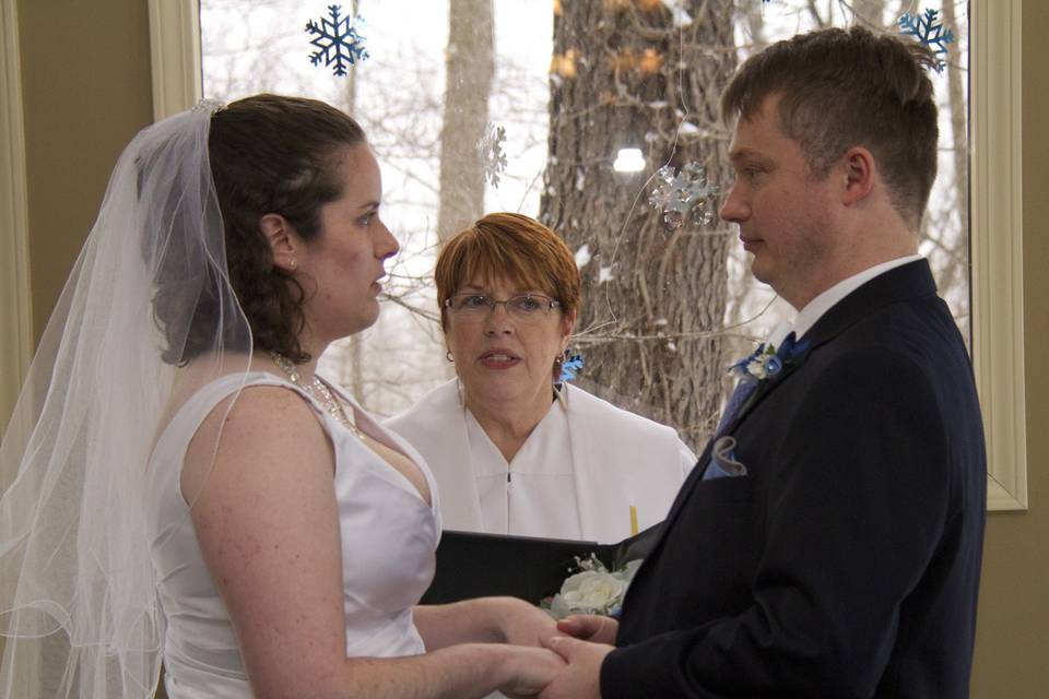 Bride and groom with officiant