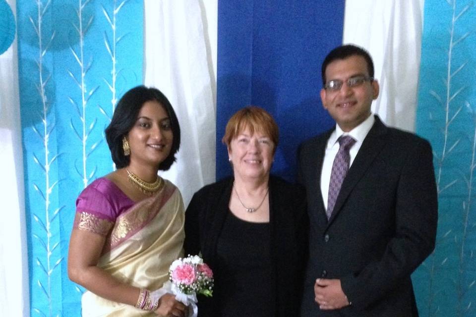 Bride and groom with the officiant