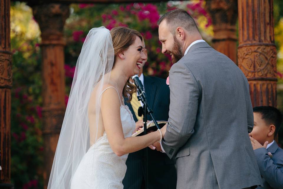 Holding hands at the wedding ceremony - Take Pics With Steph