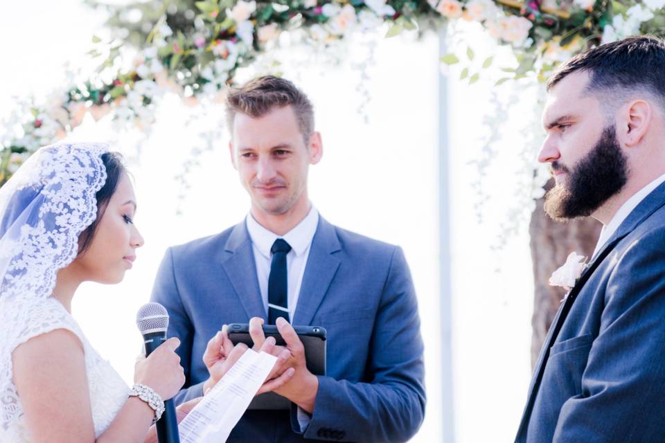 Bride reading her vows with microphone