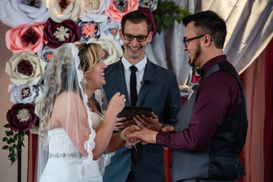 Bride and groom with officiant