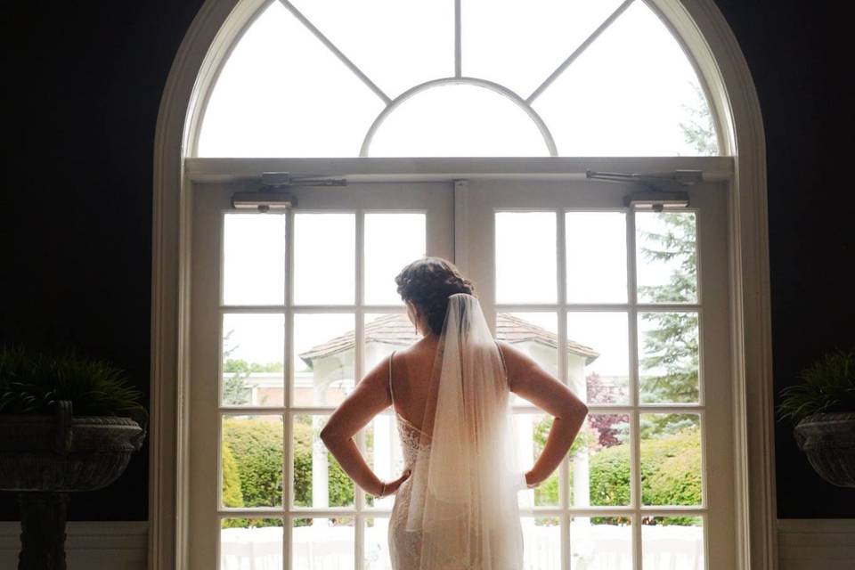 Bride looking out the door