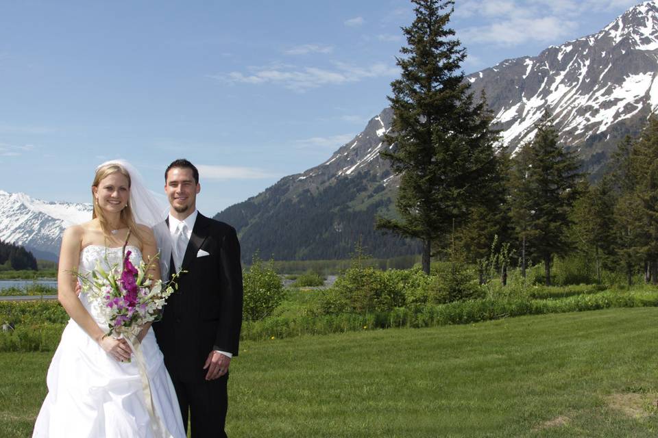 The grounds of Seward Windsong Lodge are the perfect setting for unique wedding photos.