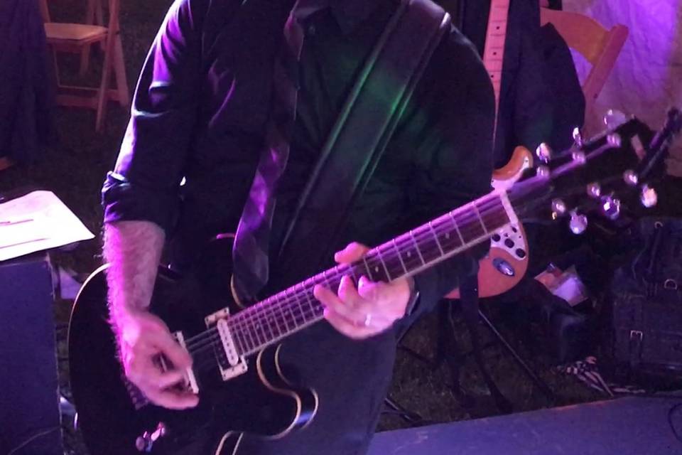 Julian taking a guitar solo