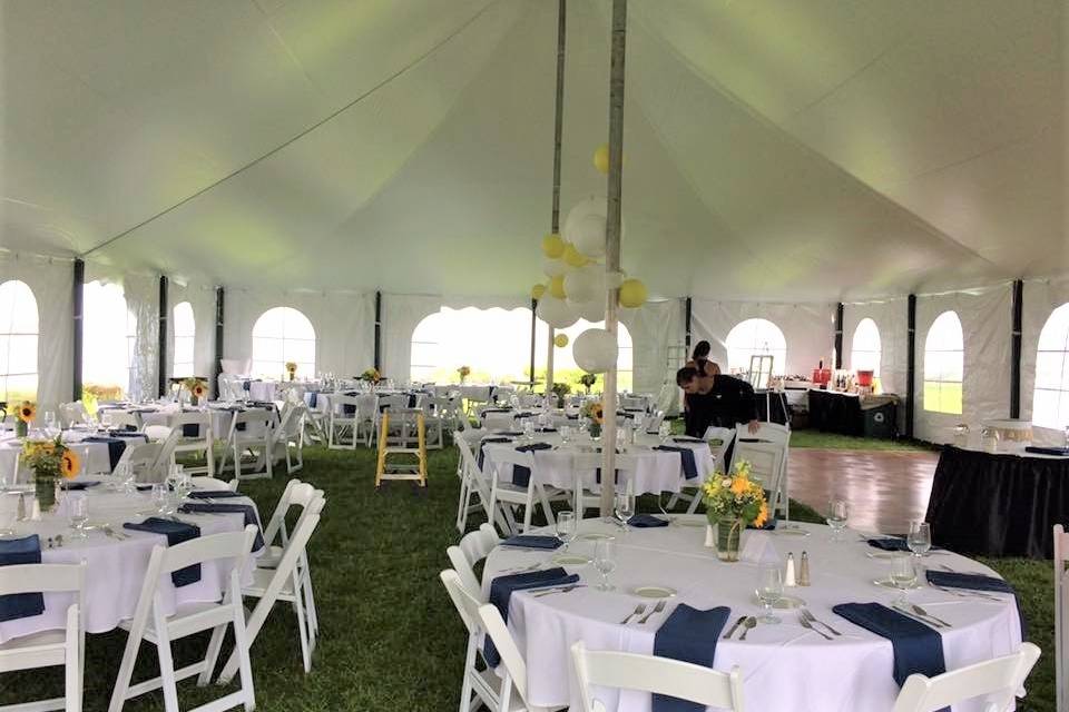 Tent layout with round tables for seating