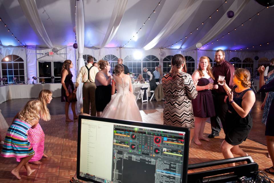 View from the dj booth as mike bell performs as wedding reception dj for this awesome tent wedding!