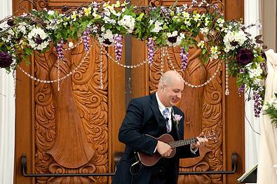 Mike bell playing ukulele as the bride walks down the aisle