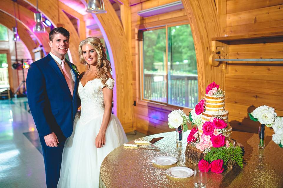 The couple with their wedding cake