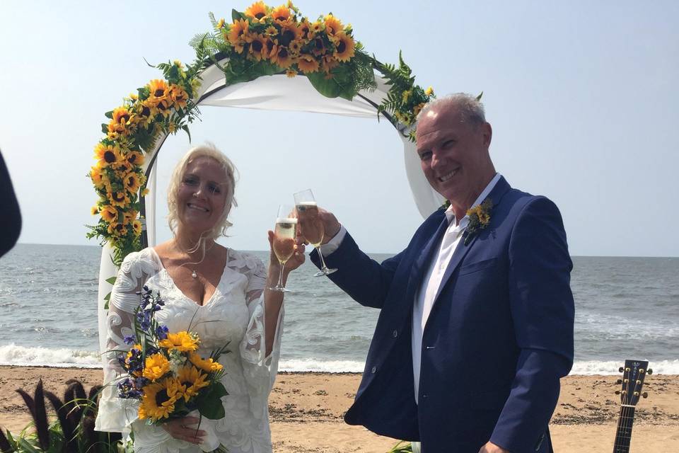 The bride and groom toast
