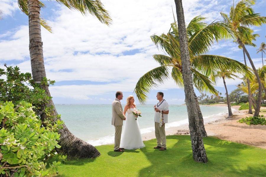 The couple with the wedding officiant