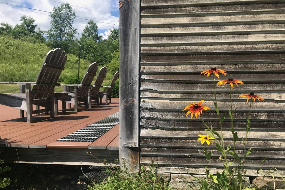 White barn and deck