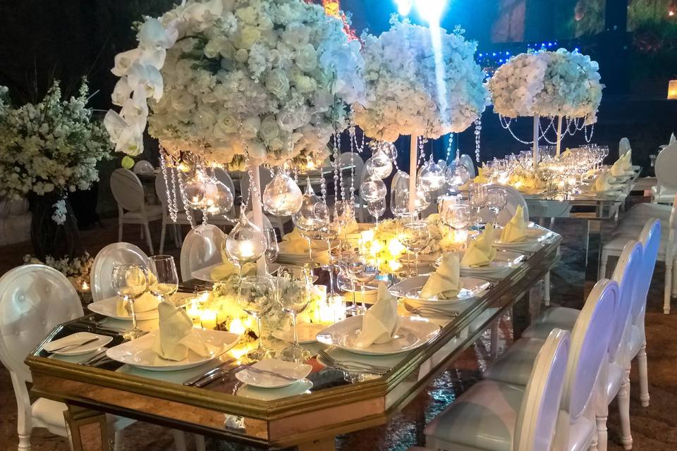 Gold mirror table with orchids