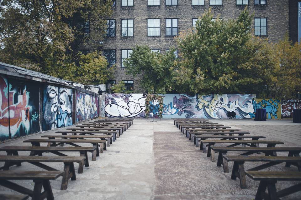 Upper Cut Boxing Gym Outdoor Ceremony using Farm Benches. Joe and Jen Photography