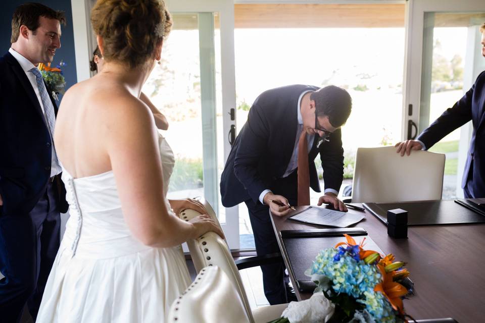 Signing the marriage documents. Photo by Kate Crabtree Photography.