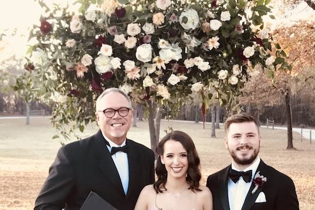 Couple with the officiant