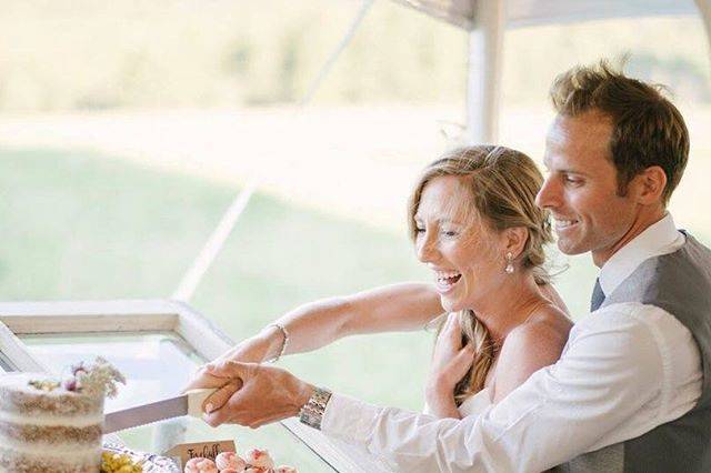 Happily cutting the cake