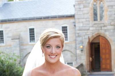 The bride pauses as she anticipates walking into the church sanctuary where she is to be married.