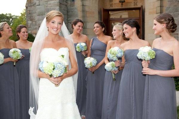 The bride and her bridesmaids gather outside of the sanctuary.