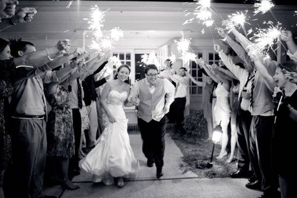 The bride and groom exit through an arch of sparklers.