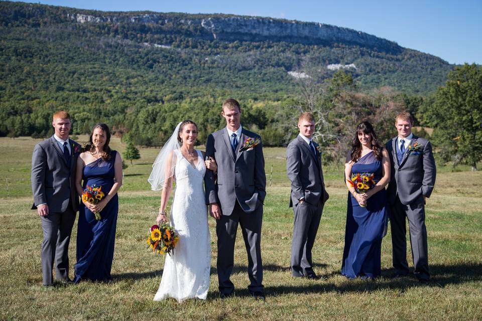 The couple with the bridesmaids and groomsmen