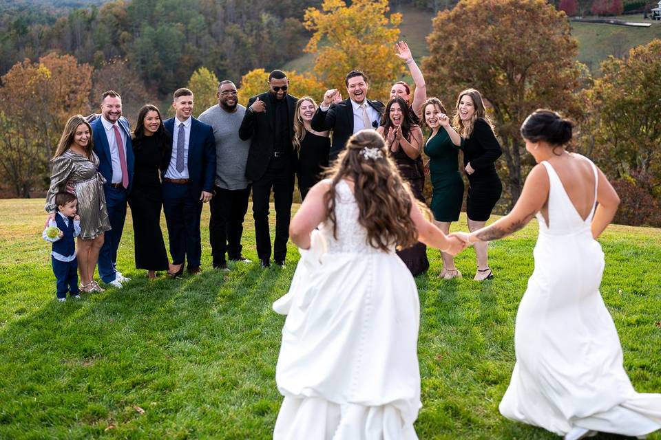 Excited friends welcome brides