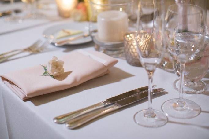 Table setting with floral and candle centerpiece