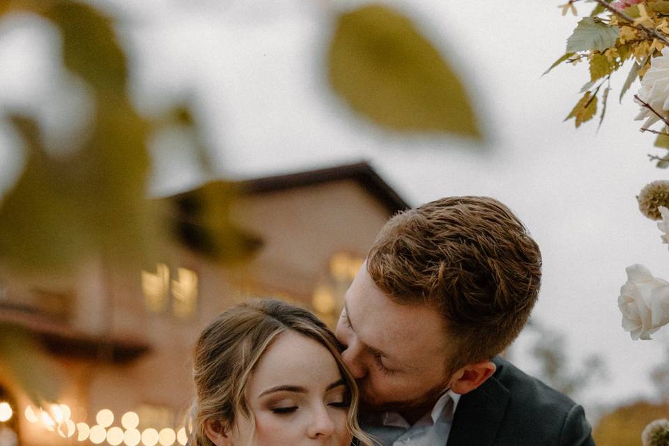 Couple under flowers