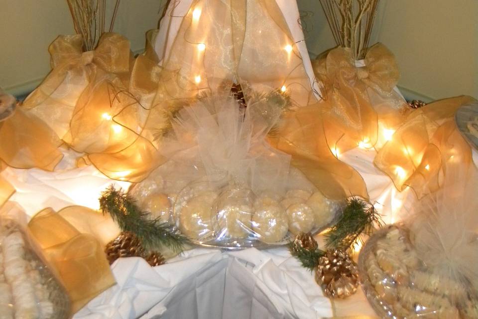 Cookie Tables are a Pittsburgh Must!  Pictured here is a Winter Wedding Cookie Table.  Our talented staff will assist you with shape, lighting, and decor for all of your display tables.